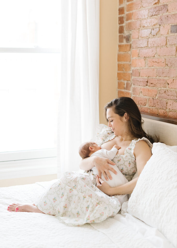 Mom breastfeeding newborn baby in Washington, DC