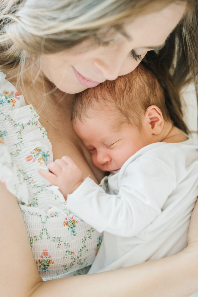 Mom snuggling newborn baby in Washington, DC